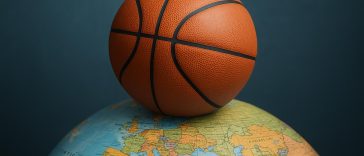 Basketball court with international flags highlighting global career opportunities in the sport