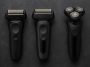 Electric shavers for coarse facial hair displayed on a bathroom counter with grooming accessories
