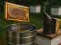 Beekeeper extracting honey from a hive using safe harvesting tools and protective gear