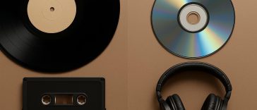 Vinyl records and digital audio equipment side by side illustrating analogue vs digital music