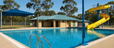 Commercial swimming pool with safety signage and equipment meeting Western Australia compliance standards