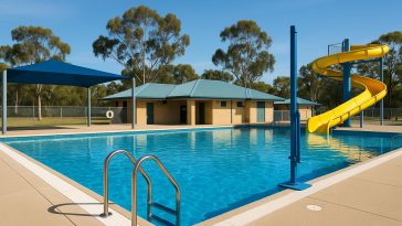 Commercial swimming pool with safety signage and equipment meeting Western Australia compliance standards